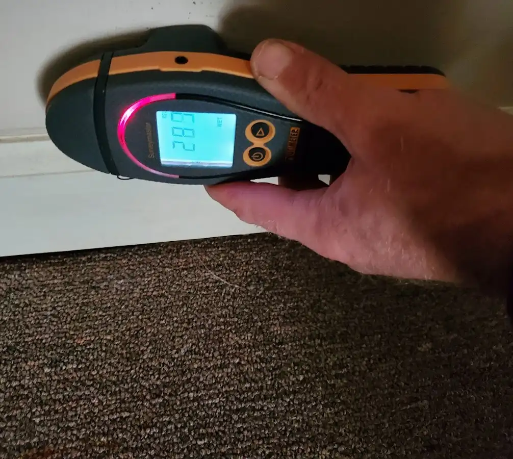 Moisture detection at baseboard during Storm Damage Restoration in Diamond Springs